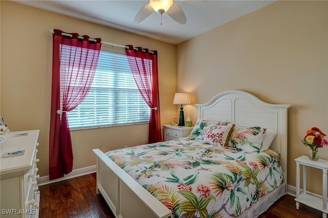 bedroom with dark hardwood / wood-style floors and ceiling fan