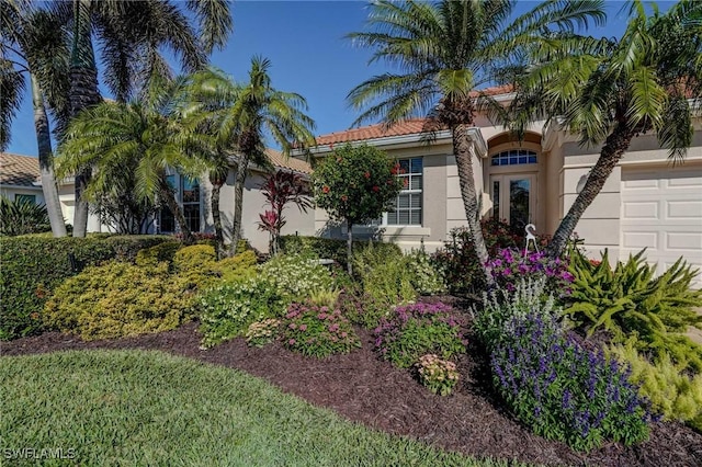 mediterranean / spanish-style house featuring a garage