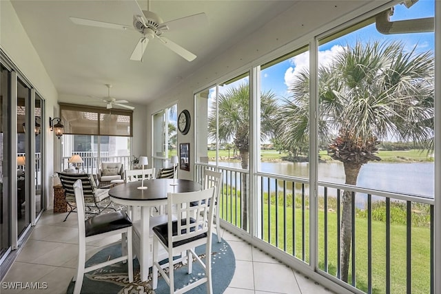 sunroom with a water view and a healthy amount of sunlight