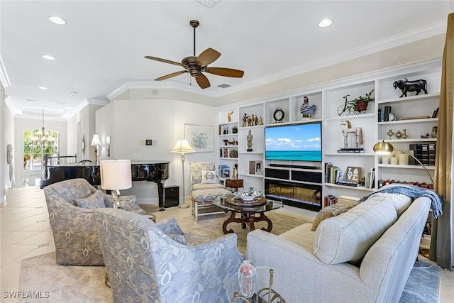 tiled living room featuring crown molding, a fireplace, and ceiling fan with notable chandelier