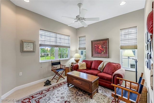 living room with light carpet and ceiling fan