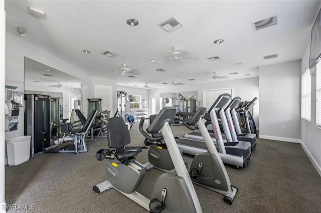 exercise room with ceiling fan and a wealth of natural light