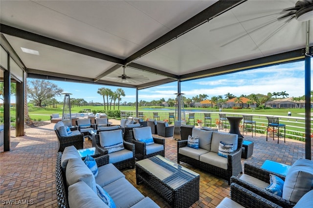 view of patio with ceiling fan and an outdoor hangout area