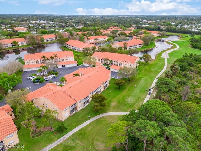 drone / aerial view with a water view