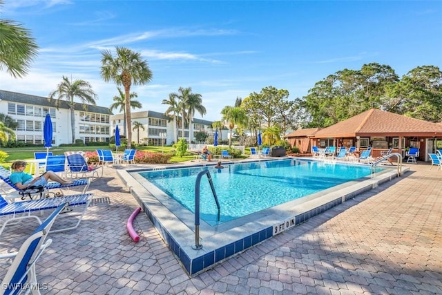 view of swimming pool featuring a patio