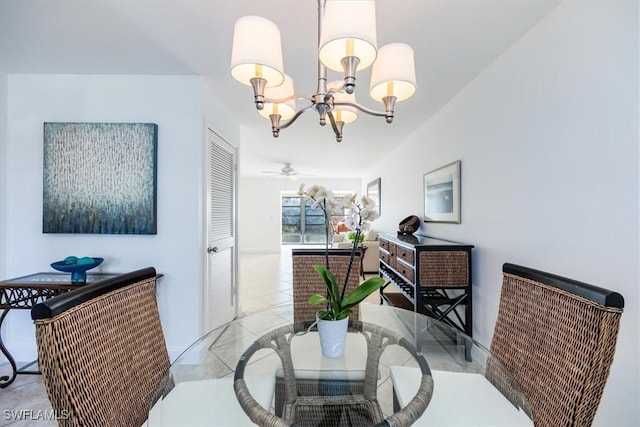 dining space featuring an inviting chandelier