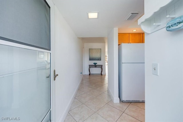 hallway featuring light tile patterned floors