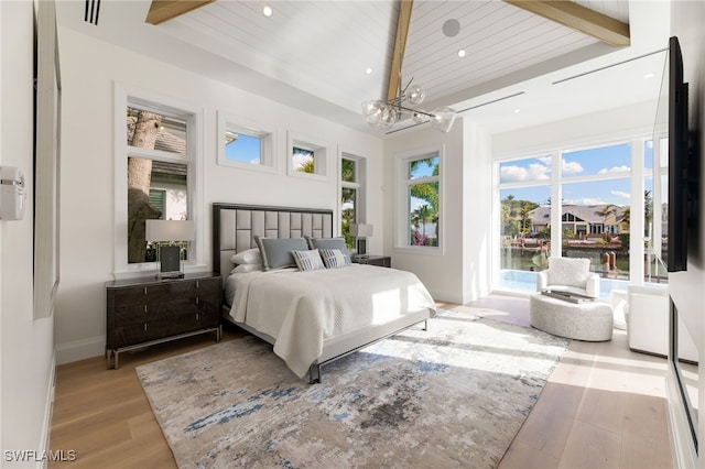 bedroom with vaulted ceiling with beams, a notable chandelier, light hardwood / wood-style flooring, and wooden ceiling