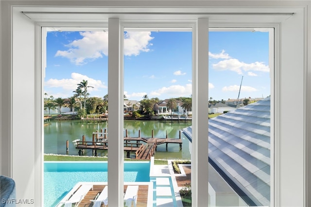 doorway to outside with a water view