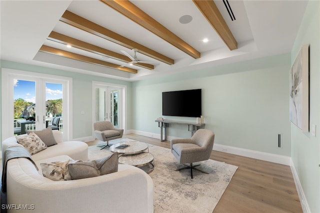 living room with wood-type flooring and french doors