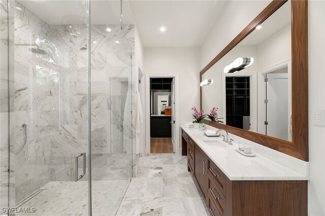 bathroom featuring vanity and an enclosed shower