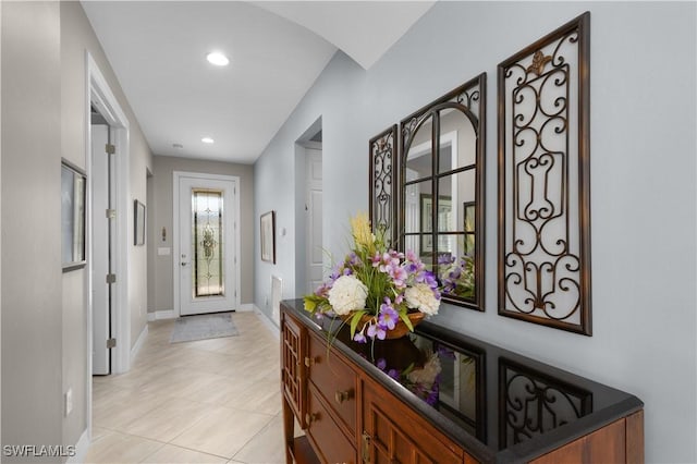 entrance foyer featuring baseboards, recessed lighting, and light tile patterned floors