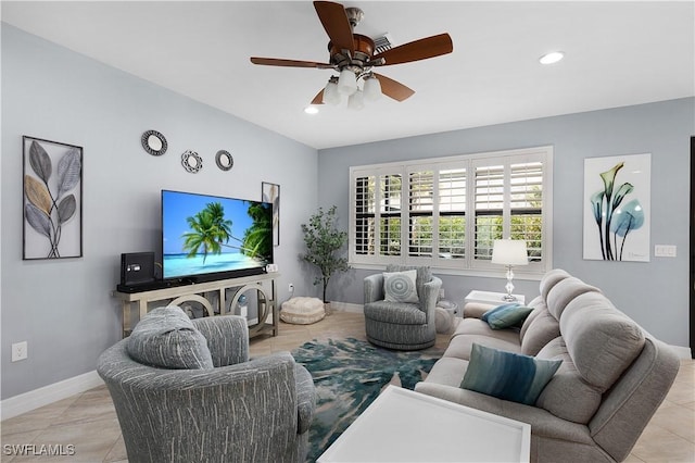 living room with ceiling fan, light tile patterned floors, recessed lighting, and baseboards
