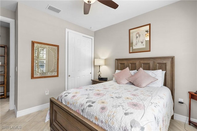 bedroom featuring a closet, baseboards, and ceiling fan