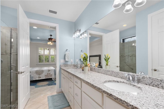 bathroom with a shower stall, tile patterned flooring, double vanity, ceiling fan, and recessed lighting