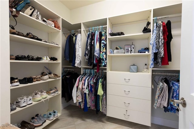 spacious closet with tile patterned flooring
