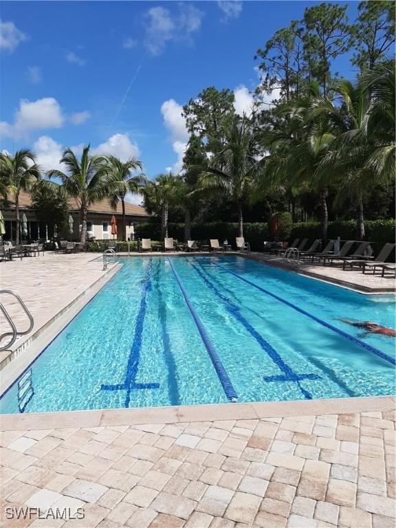 11987 Macquarie Way, Fort Myers, FL 33913 - community pool featuring a patio area