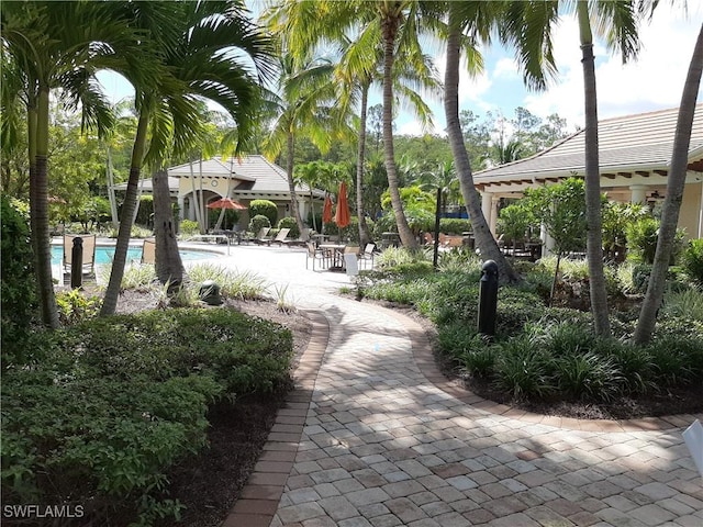 11987 Macquarie Way, Fort Myers, FL 33913 - view of community featuring a pool and a patio area