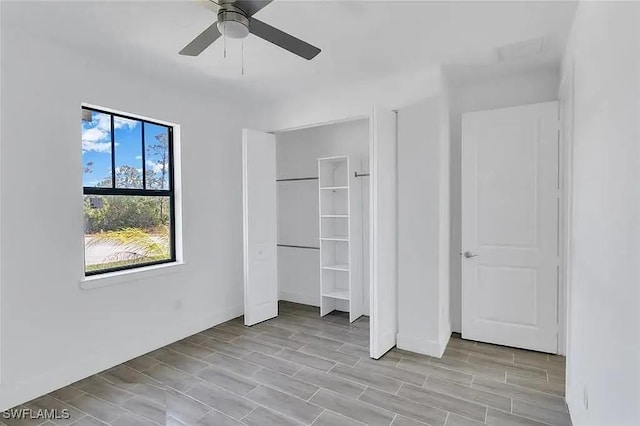 unfurnished bedroom featuring a closet and ceiling fan