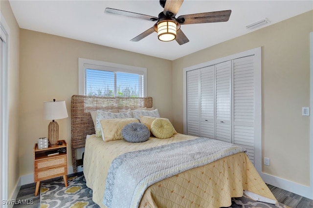 bedroom featuring hardwood / wood-style flooring, a closet, and ceiling fan