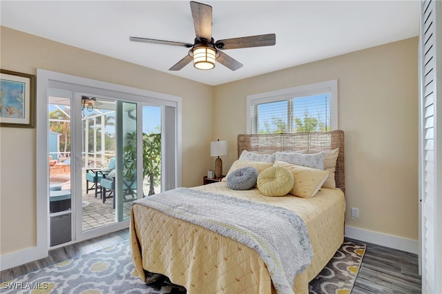 bedroom featuring ceiling fan, dark hardwood / wood-style flooring, and access to outside