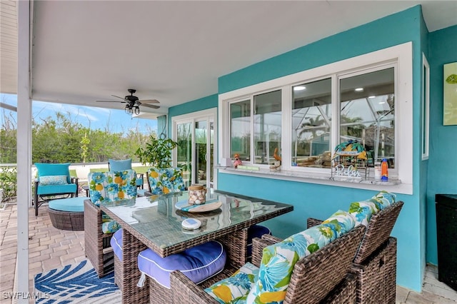 view of patio with ceiling fan and an outdoor living space