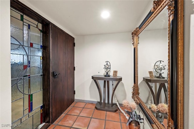 entrance foyer with light tile patterned floors