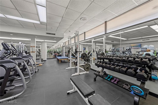 exercise room with a paneled ceiling