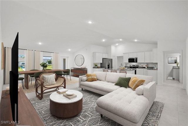 living room with high vaulted ceiling