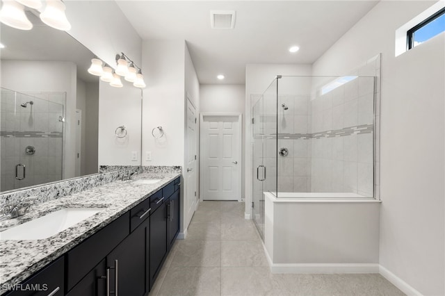 bathroom featuring vanity and a shower with shower door