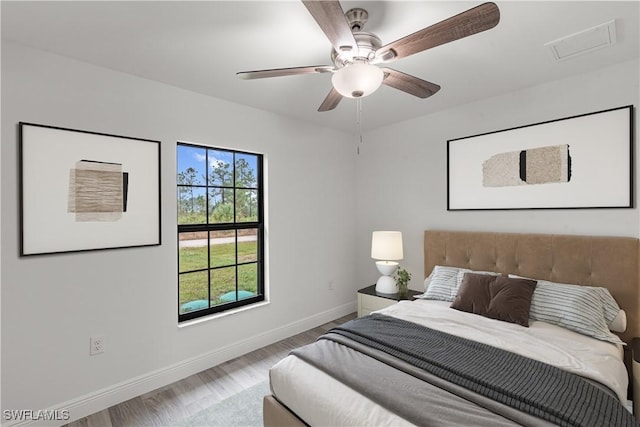 bedroom featuring ceiling fan and light wood-type flooring