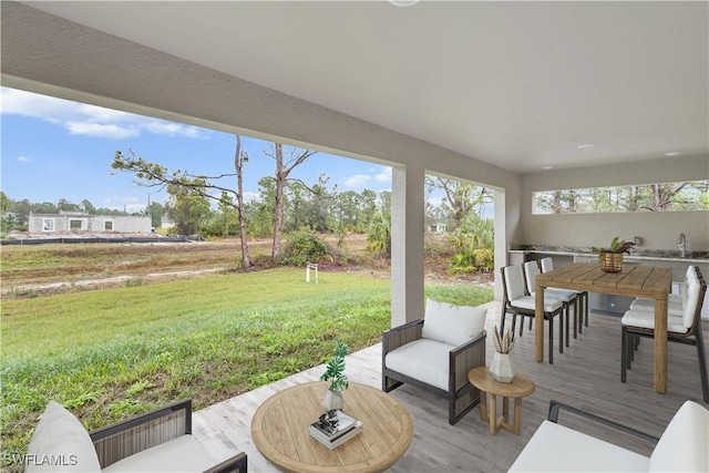 exterior space featuring sink and a lawn