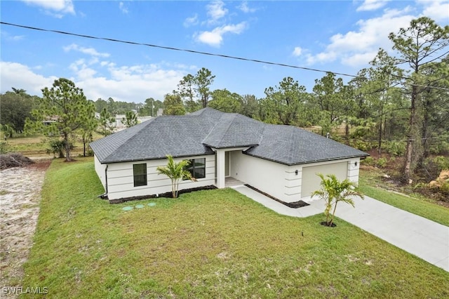 view of front facade with a garage and a front yard