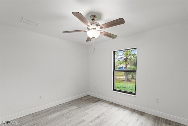 spare room featuring ceiling fan and light wood-type flooring