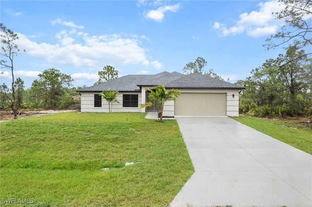 view of front of house with a garage and a front yard