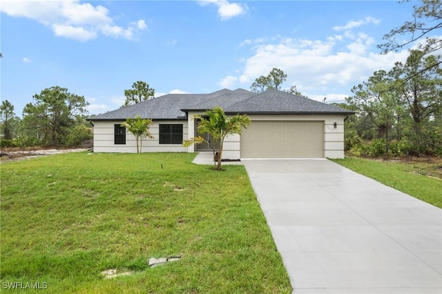 view of front of home featuring a garage and a front lawn