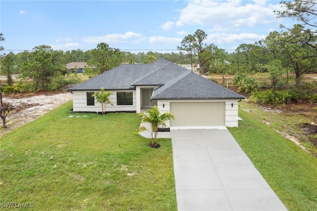 view of front of house featuring a garage and a front lawn