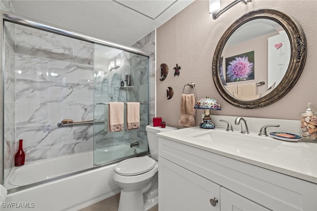 full bathroom featuring tile patterned floors, toilet, bath / shower combo with glass door, a textured ceiling, and vanity