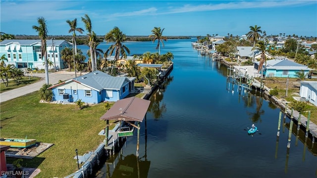 aerial view with a water view and a residential view