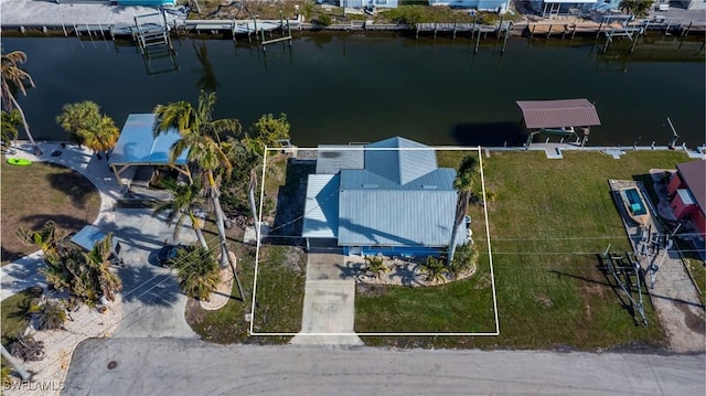 birds eye view of property with a water view