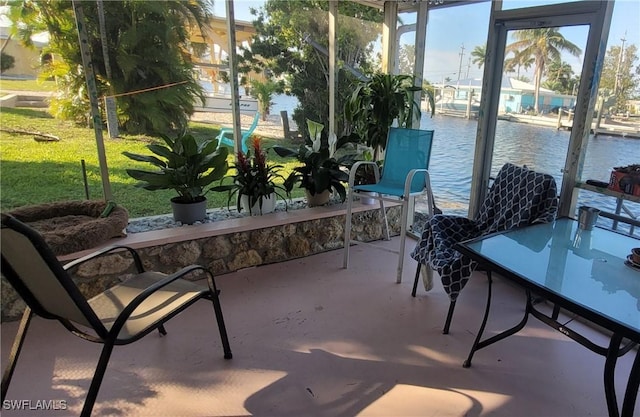 sunroom with a water view