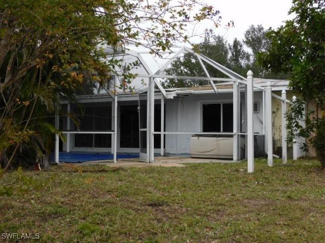 rear view of house with a lawn