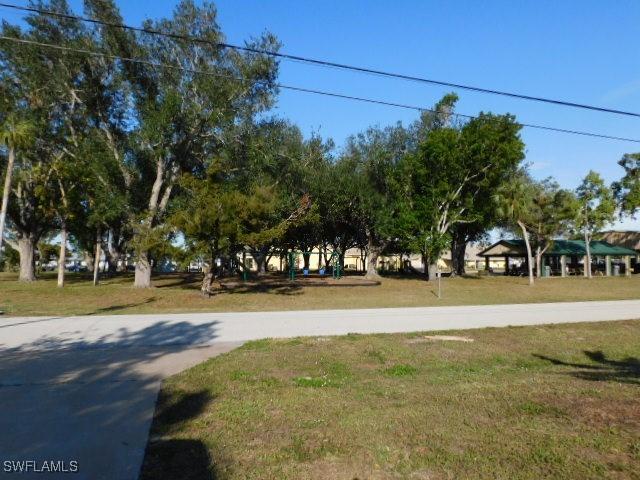 view of home's community with a lawn