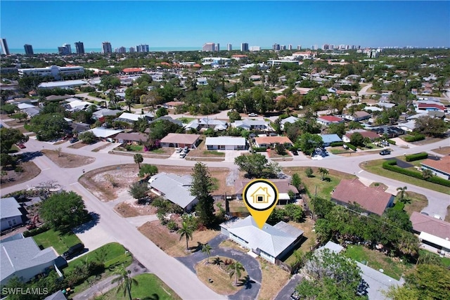 birds eye view of property with a city view