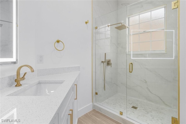 2657 Aft Ave, Naples, FL 34109 - bathroom with vanity, a shower with door, and wood-type flooring