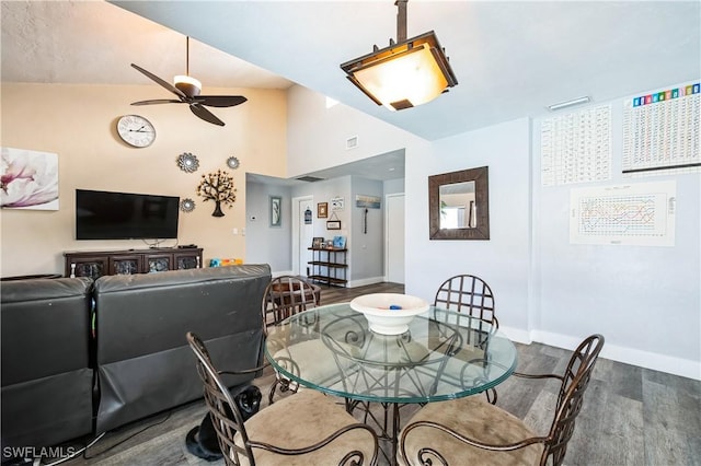 dining space featuring dark hardwood / wood-style floors and ceiling fan