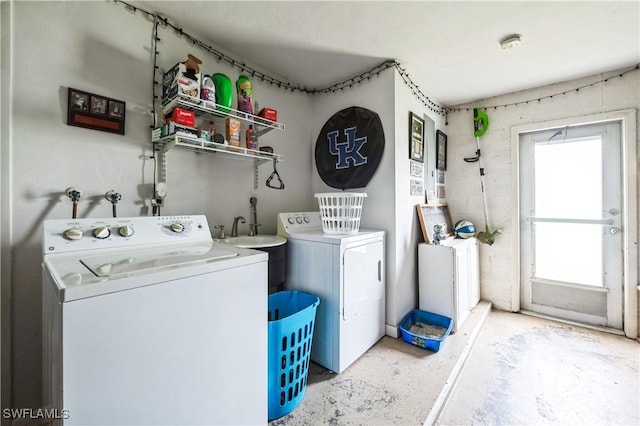 laundry area featuring a wealth of natural light and washer and dryer