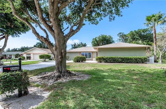 single story home with a front yard