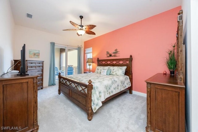 bedroom with access to exterior, light colored carpet, and ceiling fan