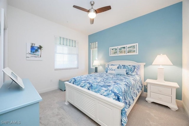 carpeted bedroom with ceiling fan